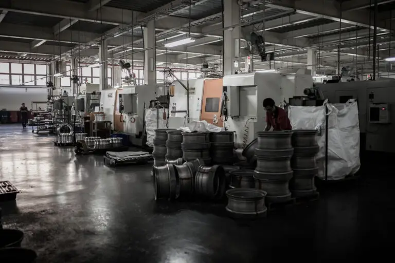 Worker stacks forgings ready to be lathe