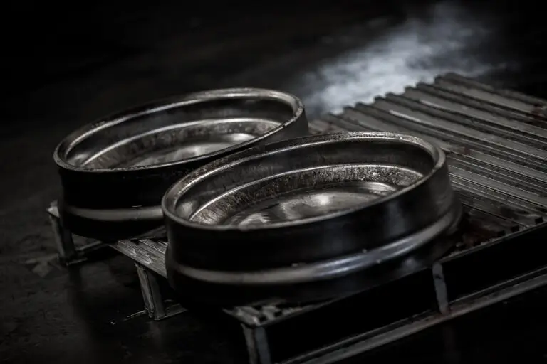 Detail of 2 forged aluminum barrels on palette